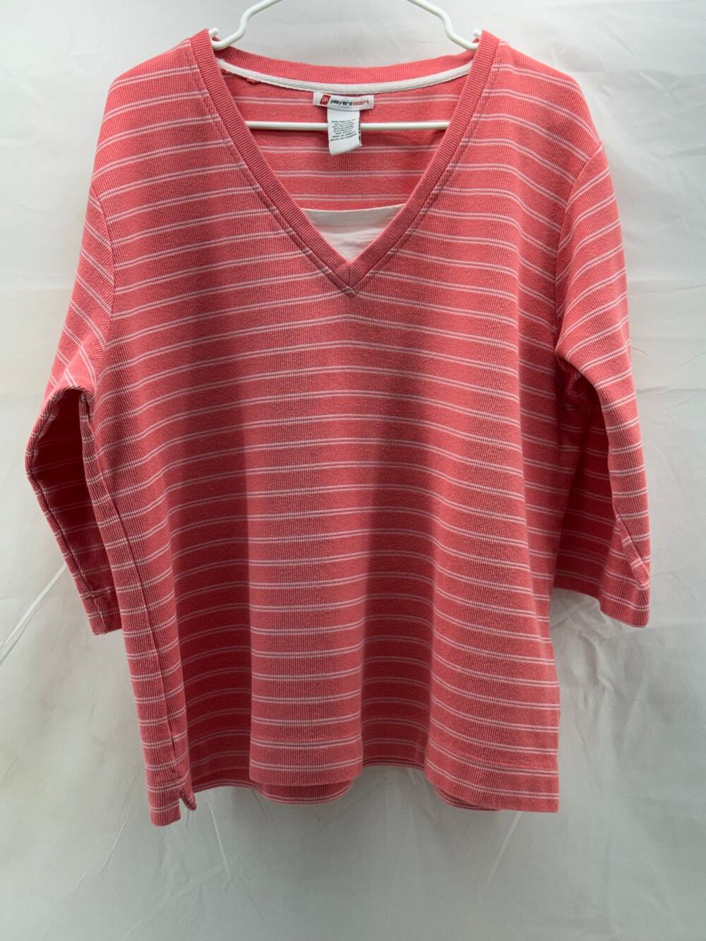 Players sport vintage women’s 3X tall 3/4 sleeve coral/white striped shirt.